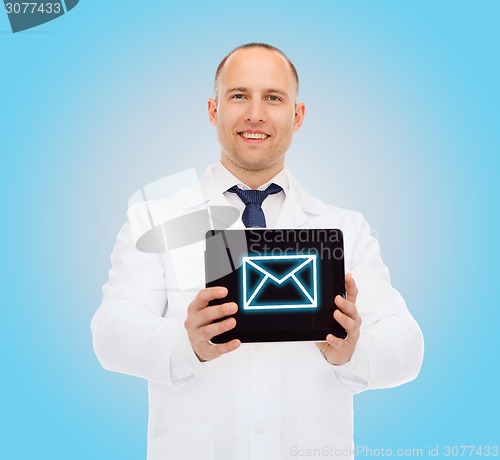 Image of smiling male doctor with tablet pc