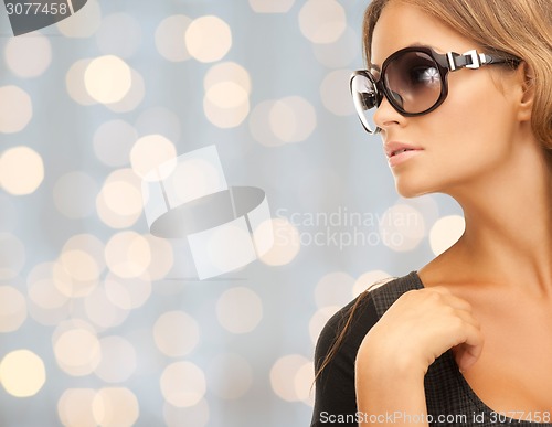 Image of close up of beautiful young woman in shades