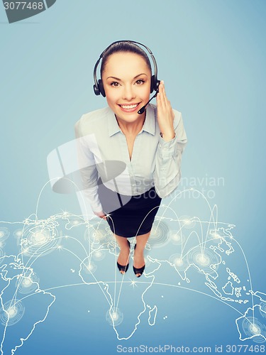 Image of friendly female helpline operator with headphones