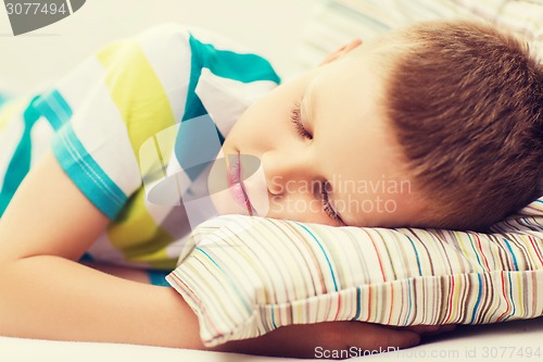 Image of little boy sleeping at home