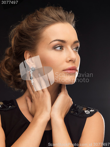 Image of woman with diamond earrings