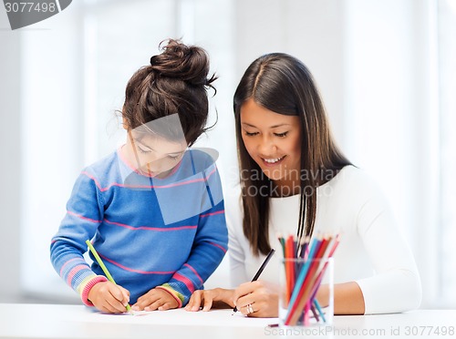 Image of mother and daughter drawing