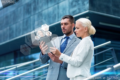 Image of businesspeople with tablet pc outdoors