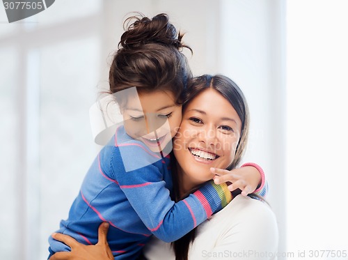 Image of hugging mother and daughter