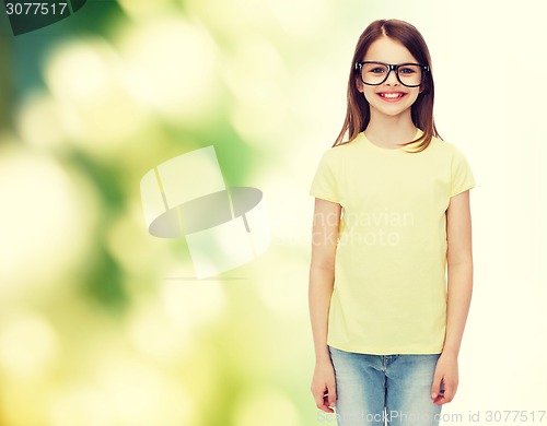 Image of smiling cute little girl in black eyeglasses