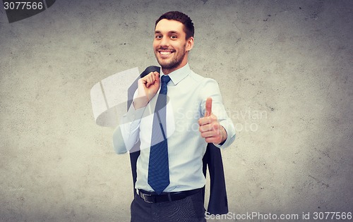 Image of handsome buisnessman with jacket over shoulder