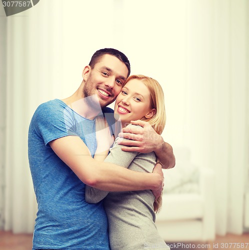 Image of smiling couple hugging