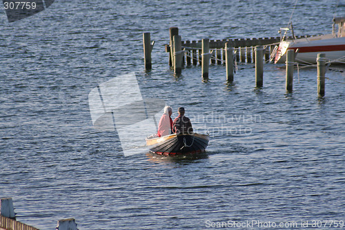 Image of An elderly couple in a boat