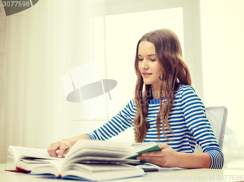 Image of happy smiling student girl with books