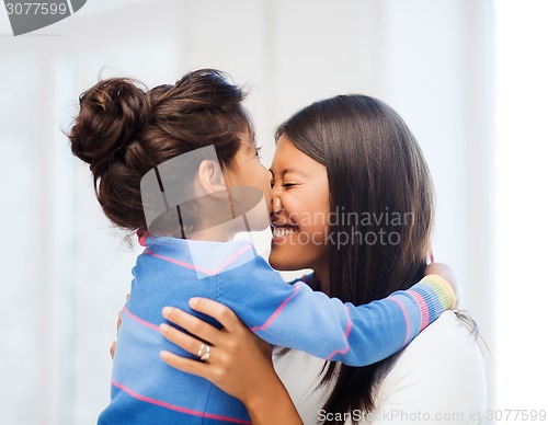 Image of hugging mother and daughter