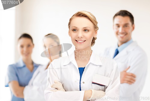 Image of smiling young female doctor in hospital