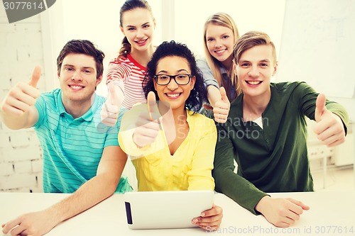 Image of smiling students with tablet pc computer at school