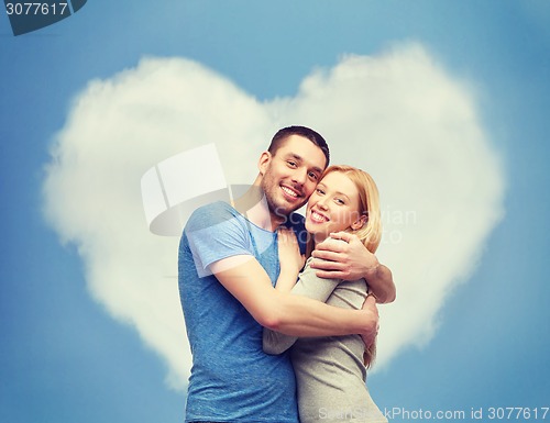Image of smiling couple hugging