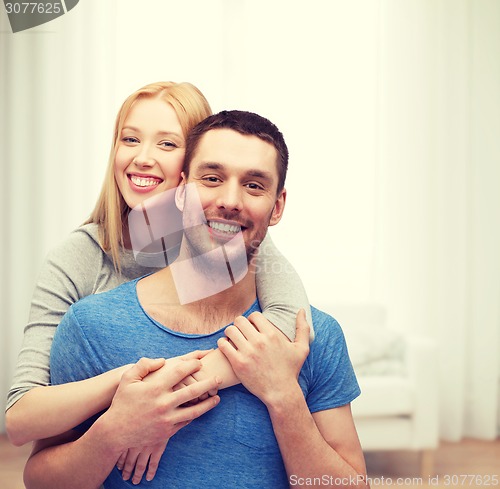 Image of smiling couple hugging