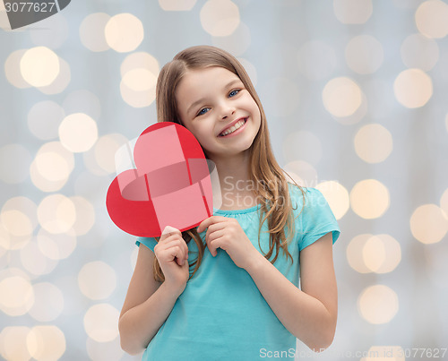 Image of smiling little girl with red heart