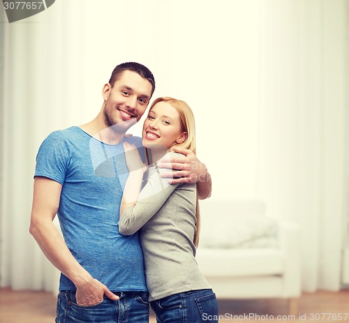 Image of smiling couple hugging