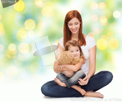 Image of happy mother with adorable girl and teddy bear