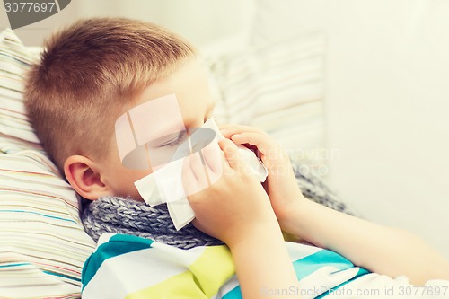 Image of ill boy with flu at home