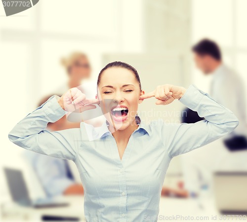 Image of angry screaming businesswoman