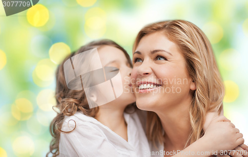 Image of happy mother and daughter hugging