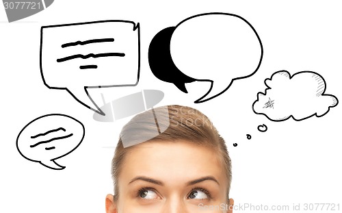 Image of close up of woman looking to text bubbles