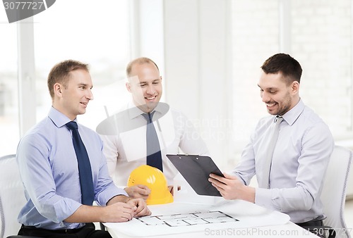 Image of happy team of architects and designers in office