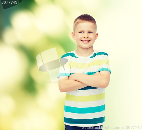 Image of little boy in casual clothes with arms crossed