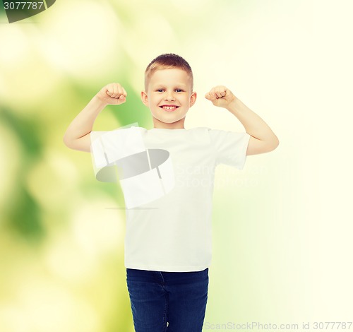 Image of little boy in white t-shirt with raised hands