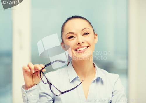 Image of laughing businesswoman with glasses