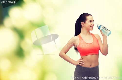 Image of sporty woman with water bottle