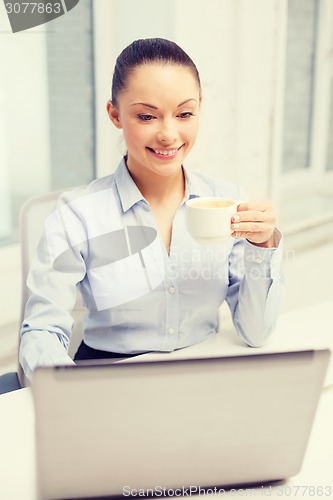 Image of smiling businesswoman or student with laptop