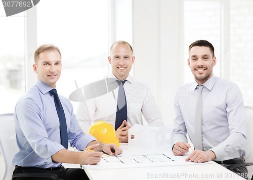 Image of happy team of architects and designers in office