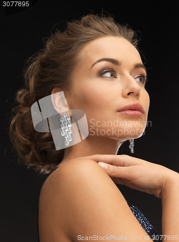 Image of woman with diamond earrings