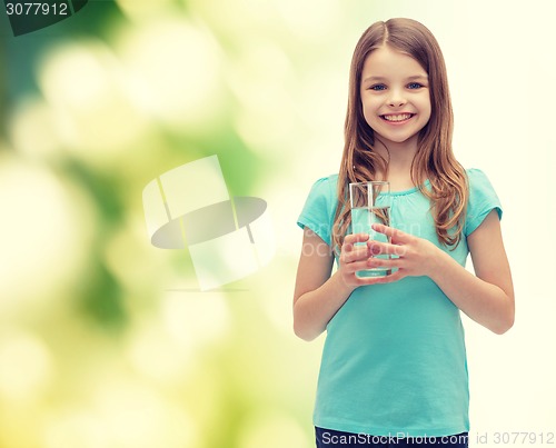 Image of smiling little girl with glass of water