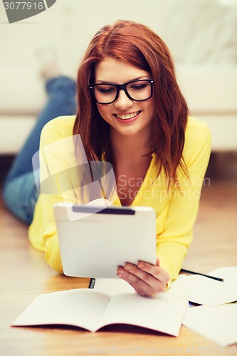 Image of student with tablet pc computer and notebooks