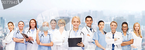 Image of smiling female doctors and nurses with stethoscope