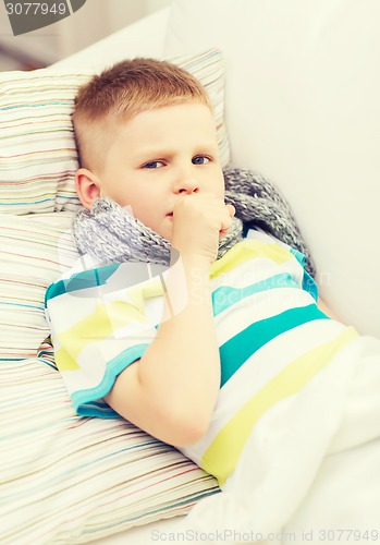 Image of ill boy with flu at home