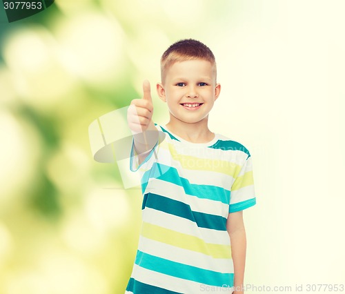 Image of little boy in casual clothes with arms crossed