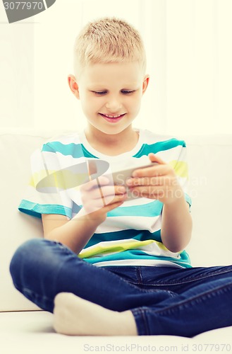 Image of smiling little boy with smartphone