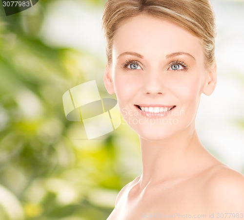 Image of close up of smiling woman over green background