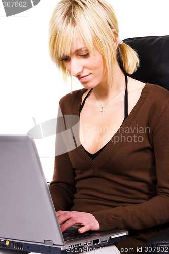 Image of young woman working on computer