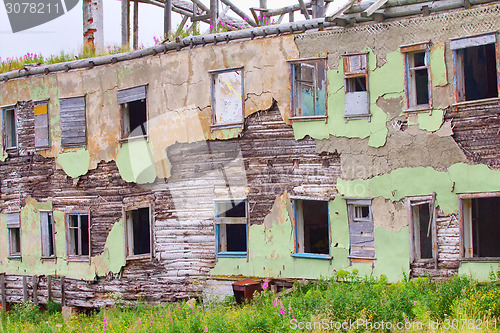 Image of ruins of destroyed an abandoned wooden house