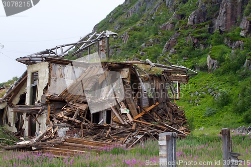 Image of ruins of destroyed an abandoned wooden house