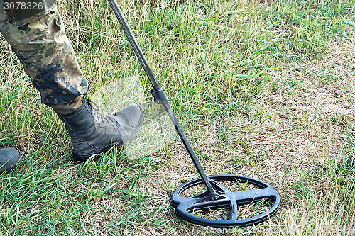 Image of Search for treasure with metal detectors.