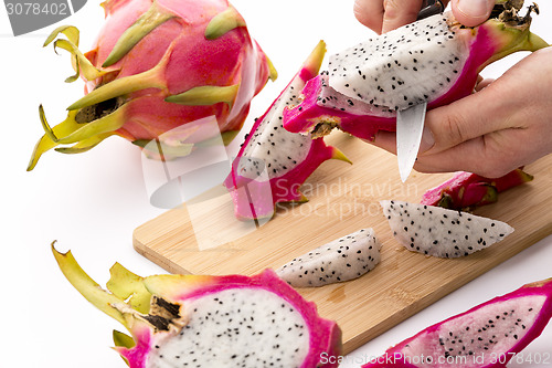 Image of Cutting Pitaya Fruit Flesh Off Its Purple Skin