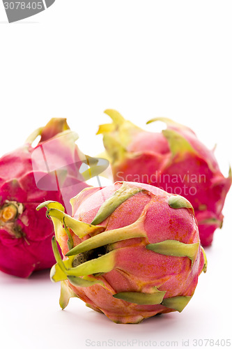 Image of Close-up On Three Whole Strawberry Pears