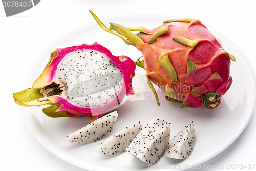 Image of Pitaya, Whole, Halved And Cut Into Fruit Wedges