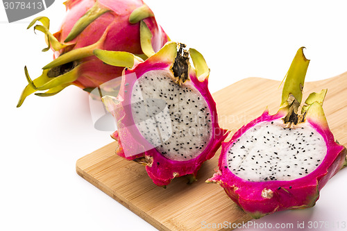 Image of Two Pitaya Halves And A Whole Dragonfruit