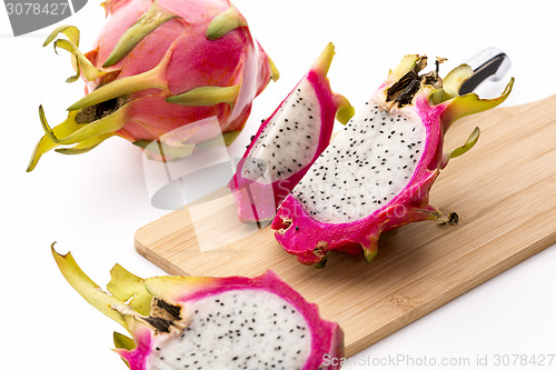 Image of Cut Pitaya Pieces On A Wooden Cutting Board
