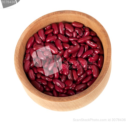 Image of Red haricot in wooden bowl isolated on white background